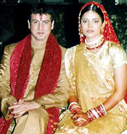 golden lehenga and sherwani with red dupatta