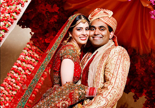 red bridal lehenga with golden sherwani with red embroidery