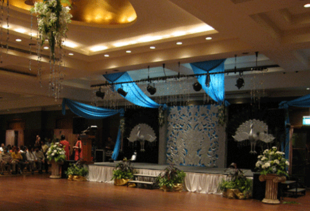 Blue and silver stage with silver peacocks on both sides
