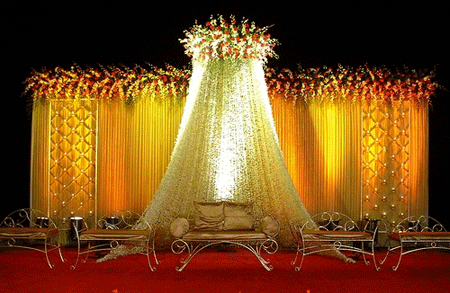 2 Golden Yellow mughal style marriage stage