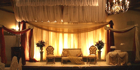 Nice stage with yellow lights at the back and lot of drape work