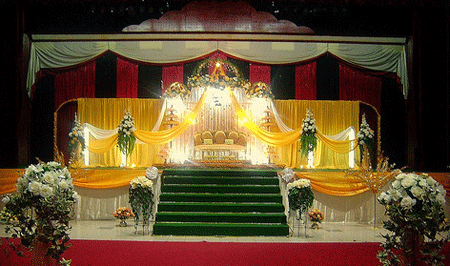 Yellow golden wedding stage with a touch of green color