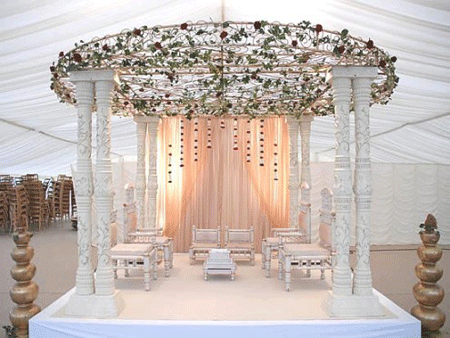 Lovely white stage with a flowery roof on top