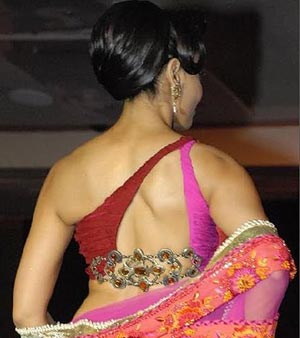 Bipasha Basu wearing a stripped and Jewelled blouse back