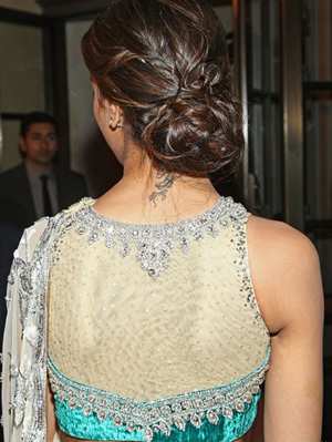 Deepika Padukone wearing a beautiful embroidered net blouse back