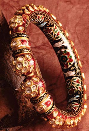 Heavy bangle kada with studded stones and colored work