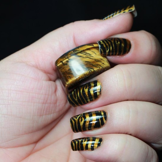 tiger print golden and black nail art