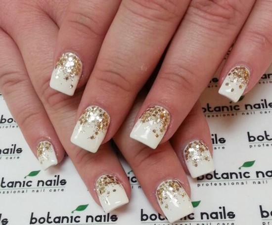 golden glitter and white nail art