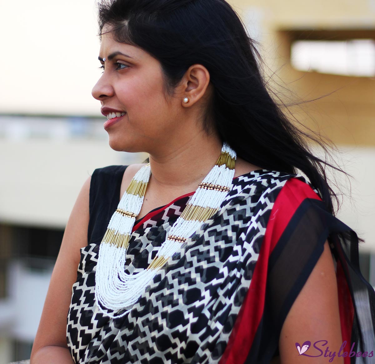 OOTD: Red and Black Printed Saree Styled With A Necklace - Stylebees.com