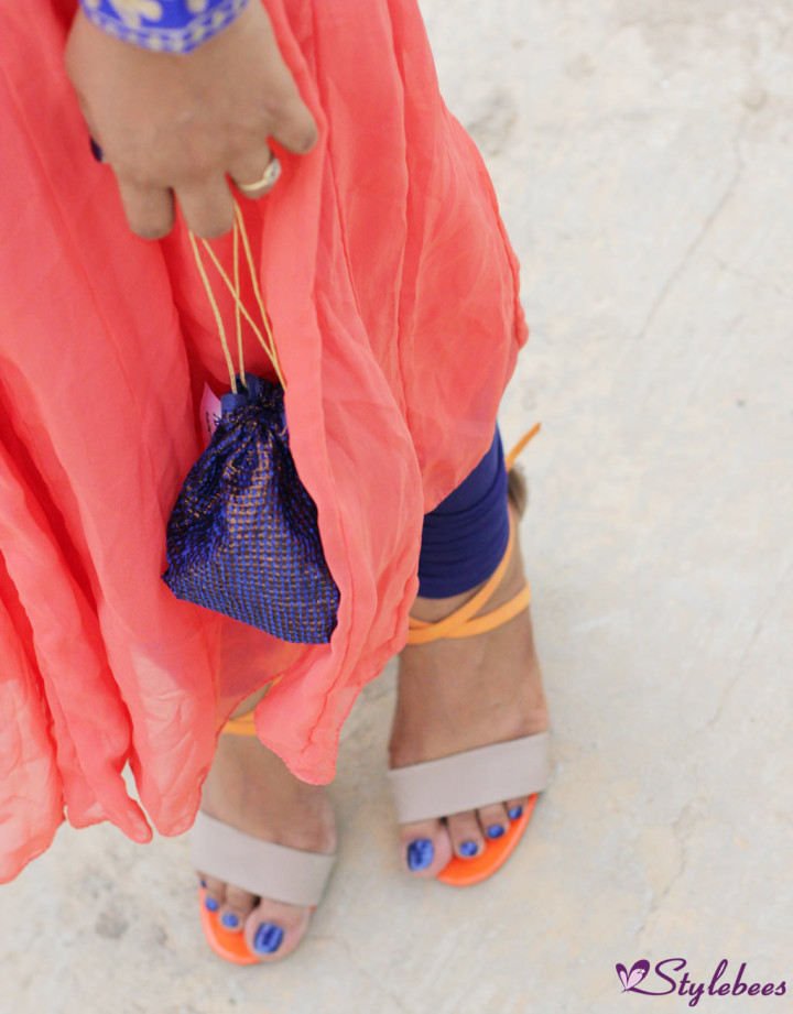 Beige and orange high heels and blue batua