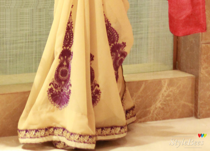 Purple color embroidery on beige and pink saree