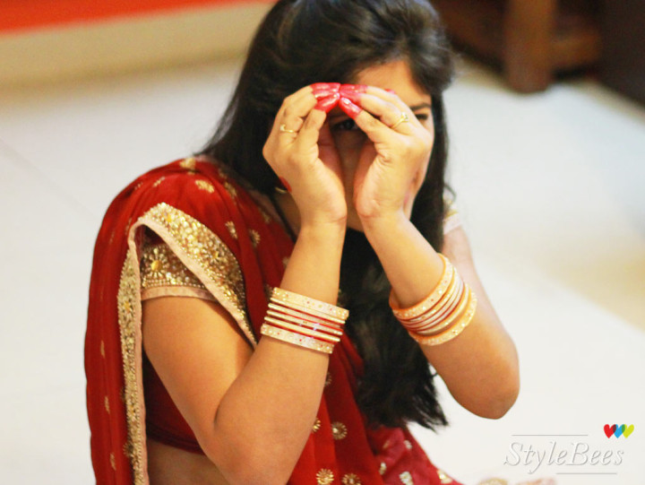 Styling for karvachauth in red saree and hand decoration with alta