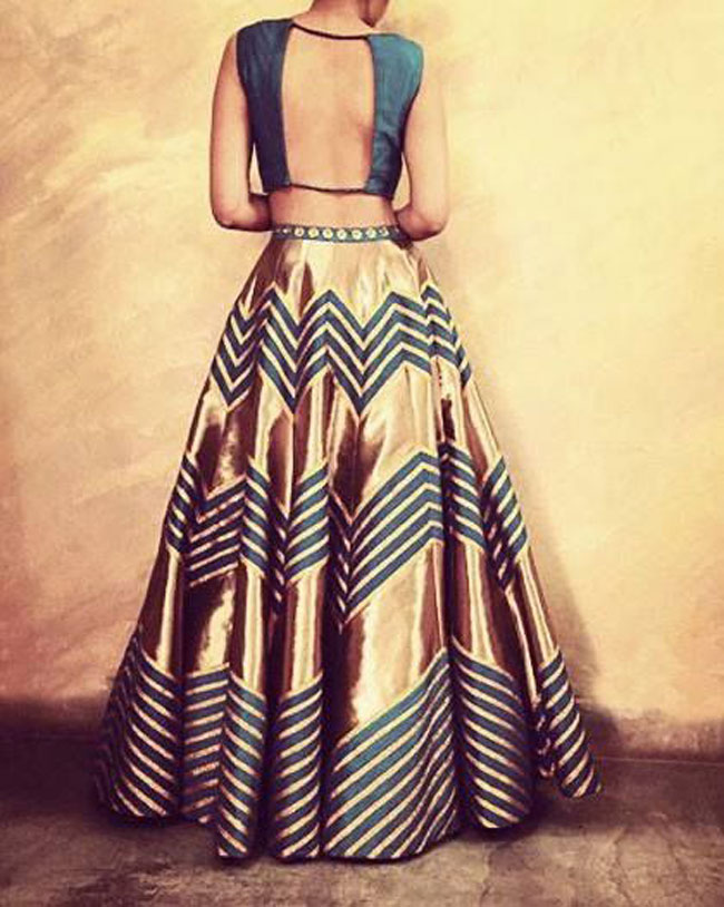 Gold and teal color lehenga with back open choli design