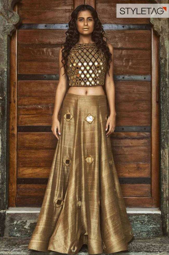 lehenga blouse design in golden color and mirror work